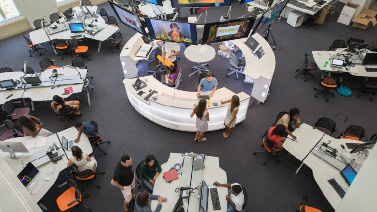 Students at work at the USC Annenberg Media Center, overhead view.