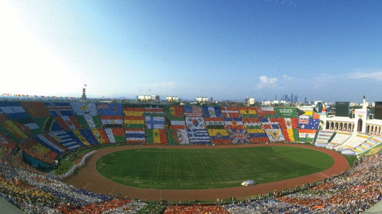A view of the Coliseum with spectators creating international flags in the crowd