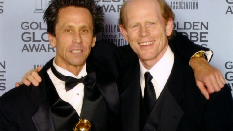 Brian Grazer and Ron Howard poses with their Golden Globe.