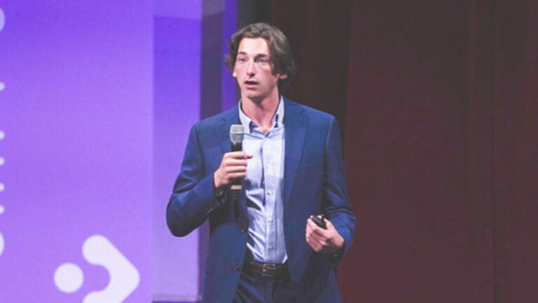 A USC student is making a presentation at the Tech4Good Symposium
