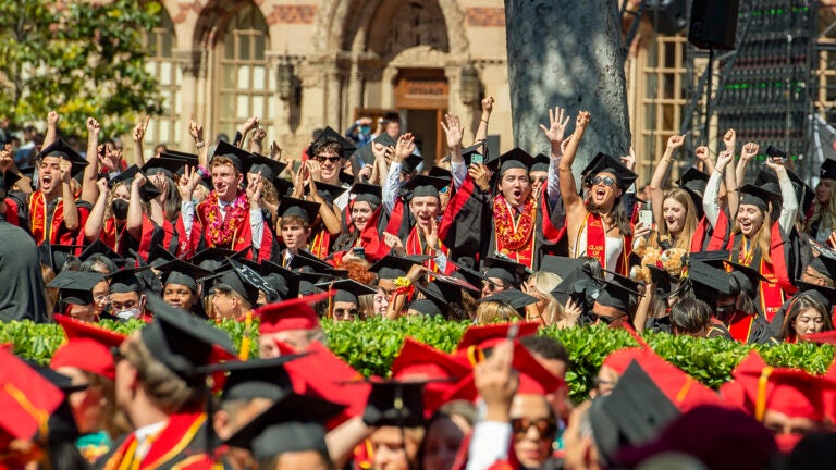 USC graduates celebrate during a commencement ceremony at University Park Campus.