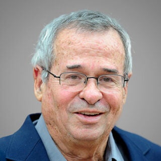 Headshot of USC faculty member Arieh Warshel.