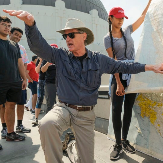 As part of the Southern California Earthquake Center's, Summer Undergraduate Research Experience (SCEC/SURE) program, USC professor of earth sciences James Dolan conducts a field trip to Griffith Observatory enabling students to look down on Los Angeles' fault lines, Thursday, June 22, 2017. (Photo by Gus Ruelas)