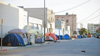 Tents lining the streets at a homeless encampment.