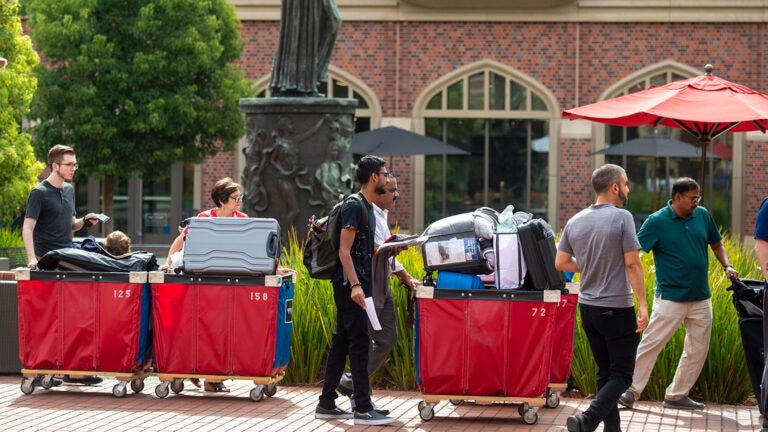 Family and freshman honor students wait to enter during McCarthy Honors early move In