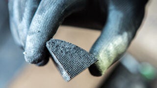 A broken piece of a platinum catalytic converter.