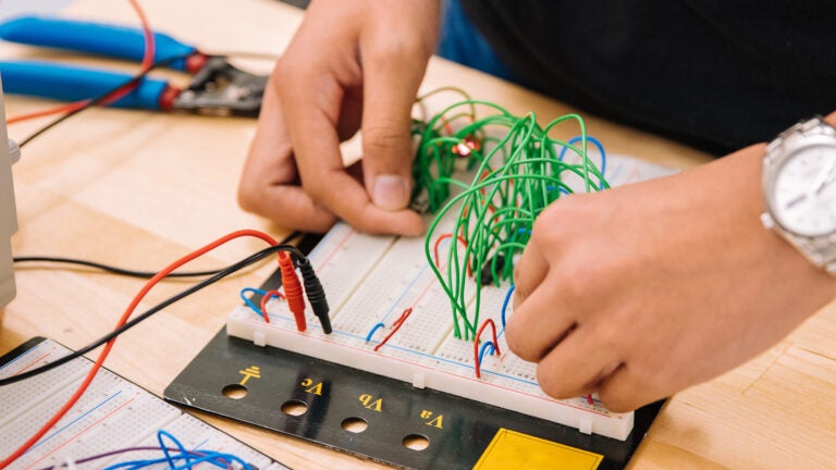 A person on a electric circuit board.