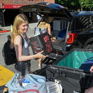 Allegra Lumb, 22, center back and mother Justin Lumb, front right, help freshman Tati Lumb, 19, with her stuff during move-day, Aug. 16, 2023.