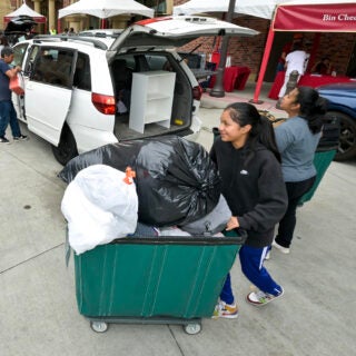 Families help out as they unload during move-day