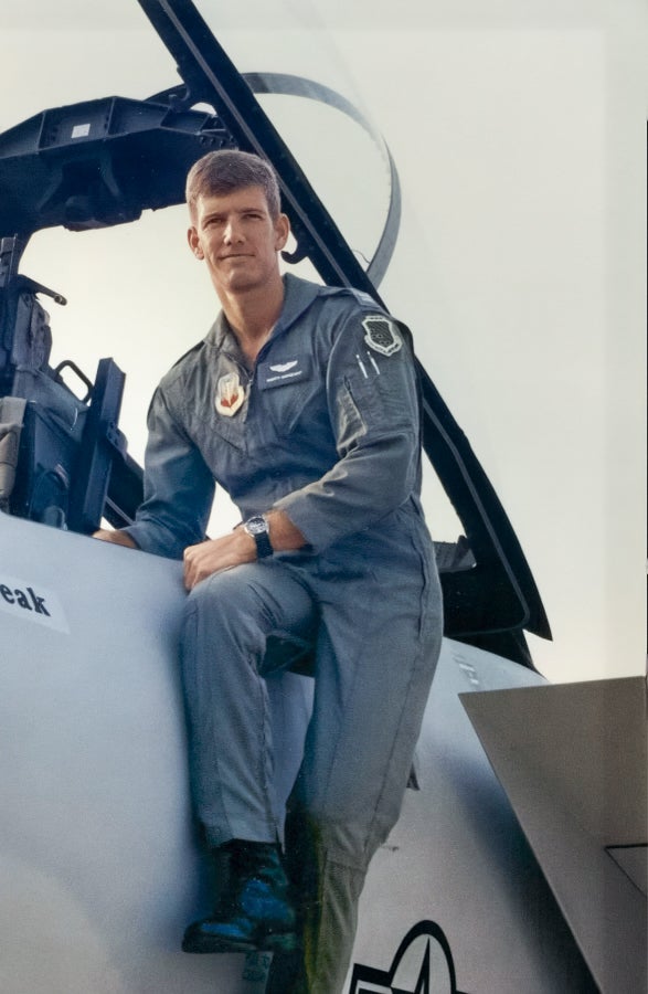 Marty Sargeant in uniform next to jet