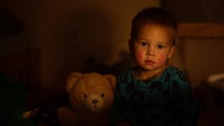 A child with a teddy bear. Photo by Tim VanDoren on Unsplash