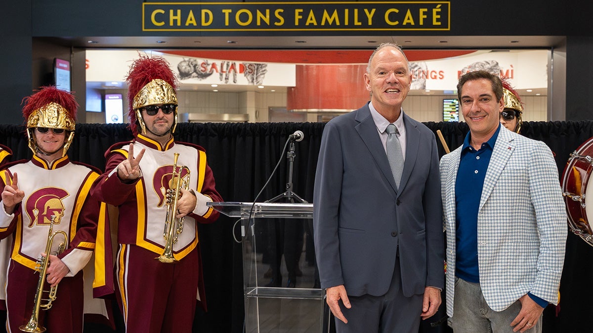 Geoffrey Garrett and Chad Tons with members of the USC Trojan Marching Band